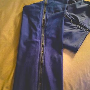 Nike sport pant that hook and eye down leg